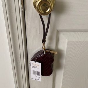 New with tags, heart shape, wine in color.